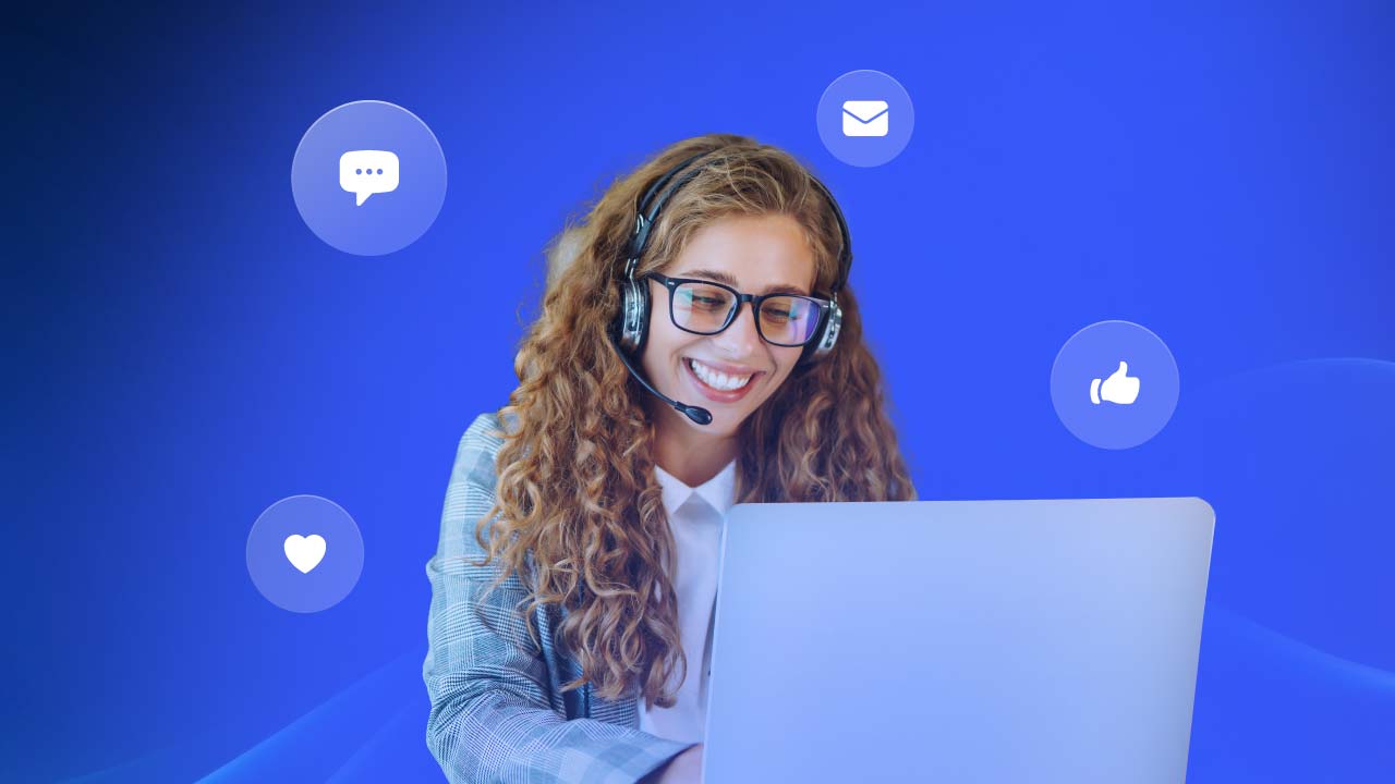 A customer experience agent works on a laptop.