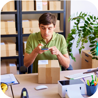 Man taking a picture of a package