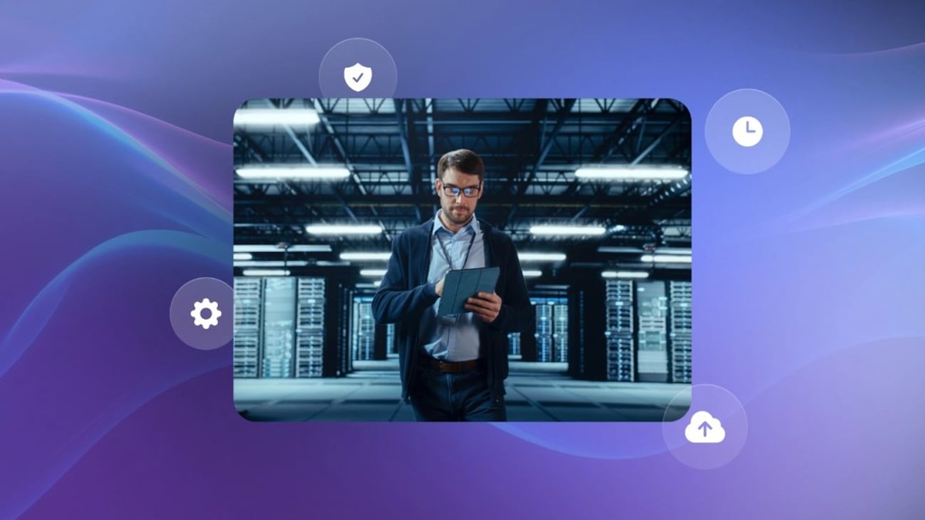 An IT manager on the career path monitors servers with a tablet while walking through a modern data center with digital graphics.