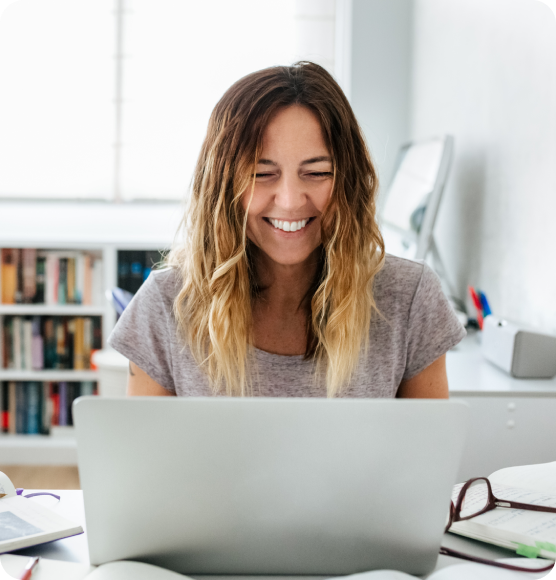 Smiling woman working on her laptop