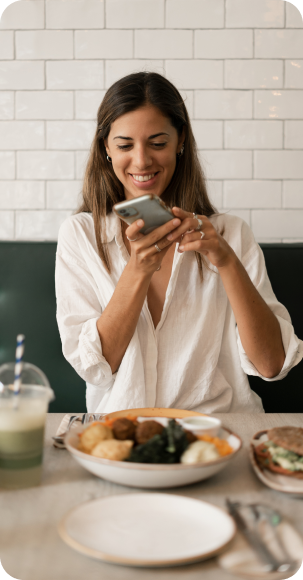 Woman taking picture of food