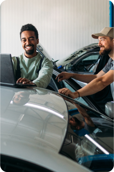 Two men looking at laptop