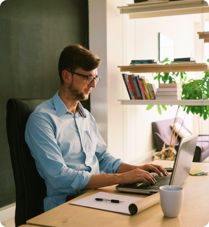 Man typing on laptop