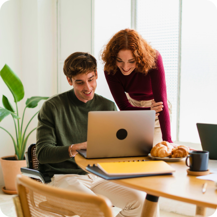People looking at laptop