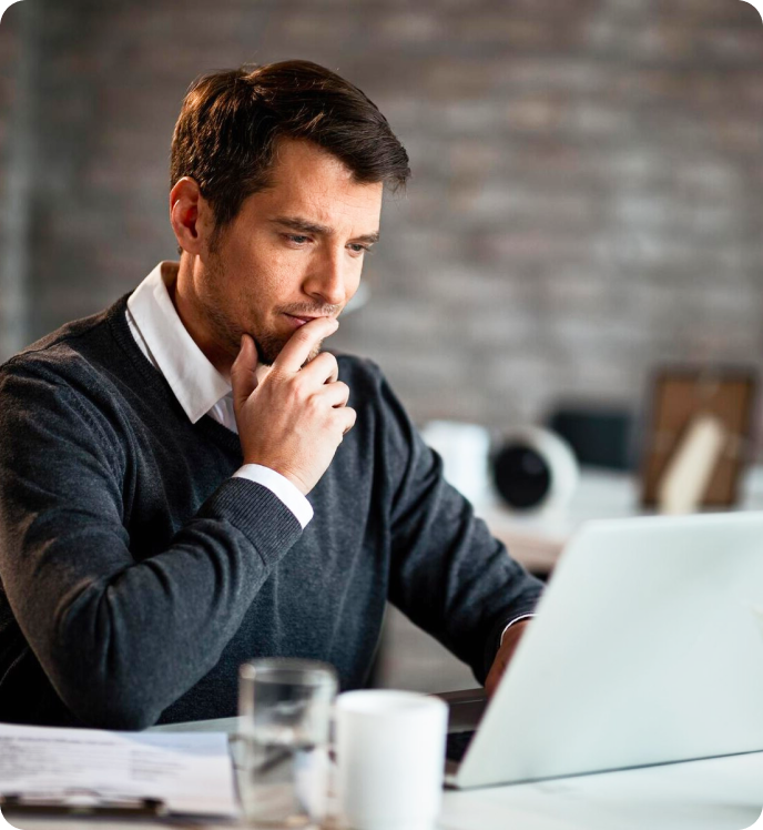 Man Looking On Laptop